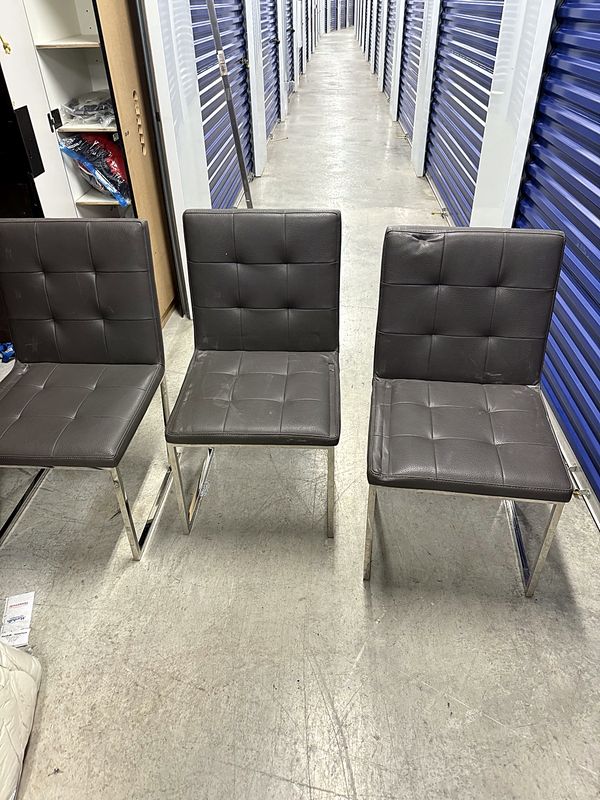 Tufted dining chairs. Set of three, button-tufted vinyl